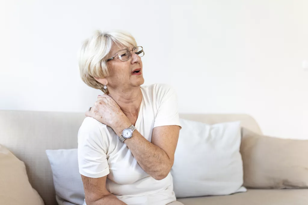 Old women suffering from neck pain. Older people are more likely to suffer from neck sprain