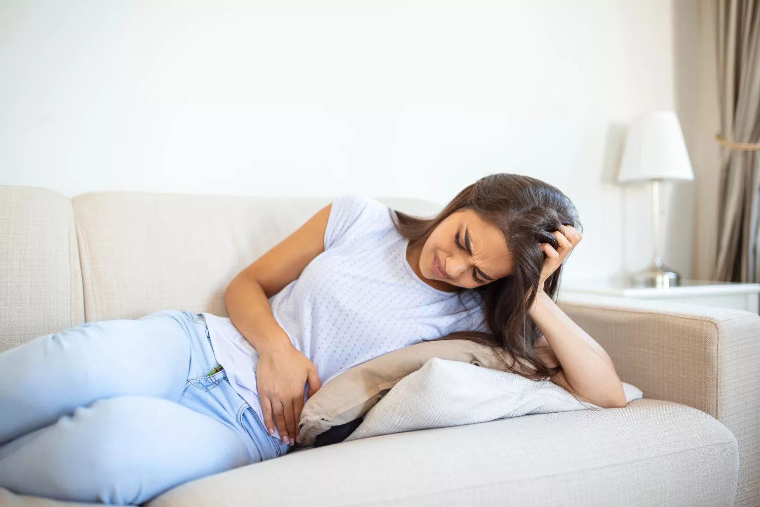 Image of a woman with abdominal period cramps