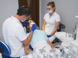 Patient getting a procedure of dental sealants