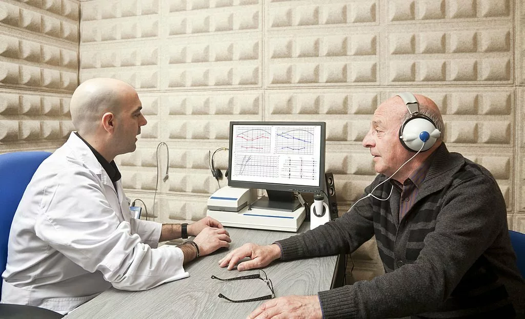 Image of a medic performing hearing test on a patient