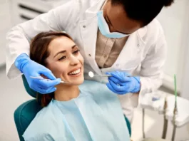 a dentist examining patient's teeth