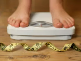 Image of a person on a weighing scale. Morbid Obesity