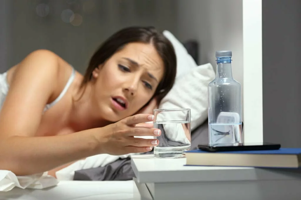 Image of a young lady drinking water