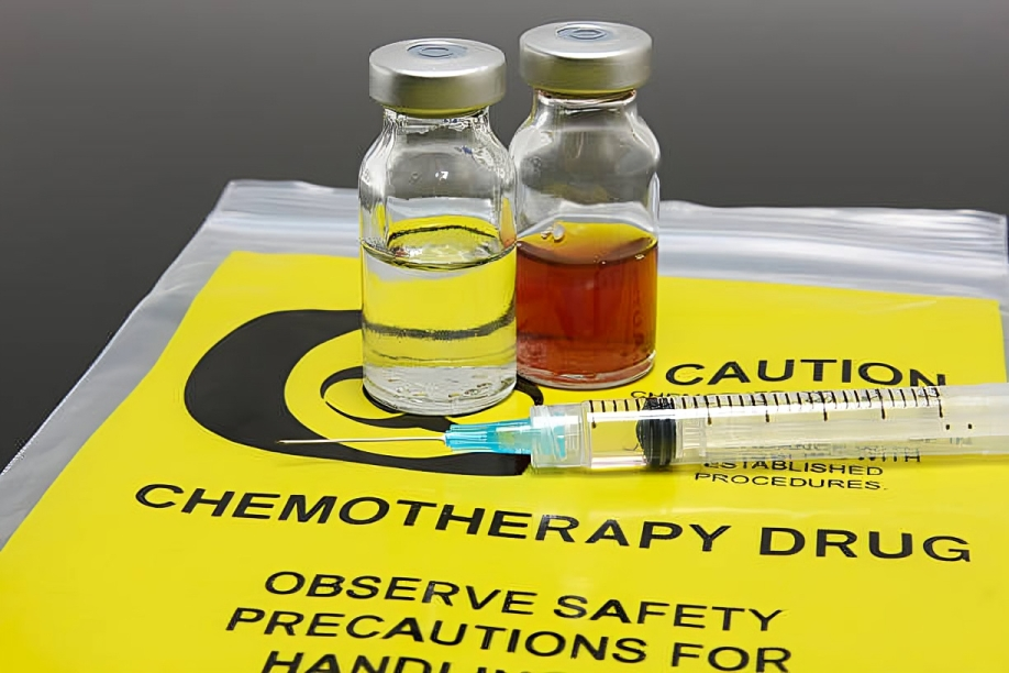 Vials of chemotherapy drugs with a syringe