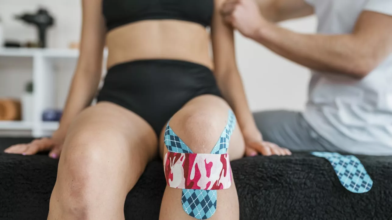 Image showing taping technique for knee pain 